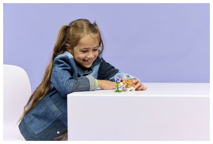 Niedlicher Hamster mit Blume 