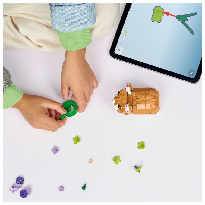 Niedlicher Hamster mit Blume 